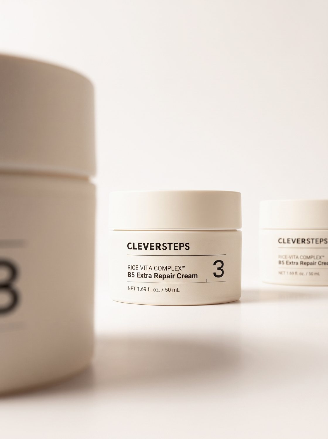 B5 Extra Repair Cream jars in soft focus